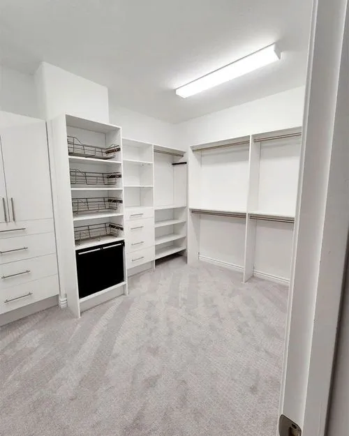 Finished custom walk-in closet system in a Pinellas County home